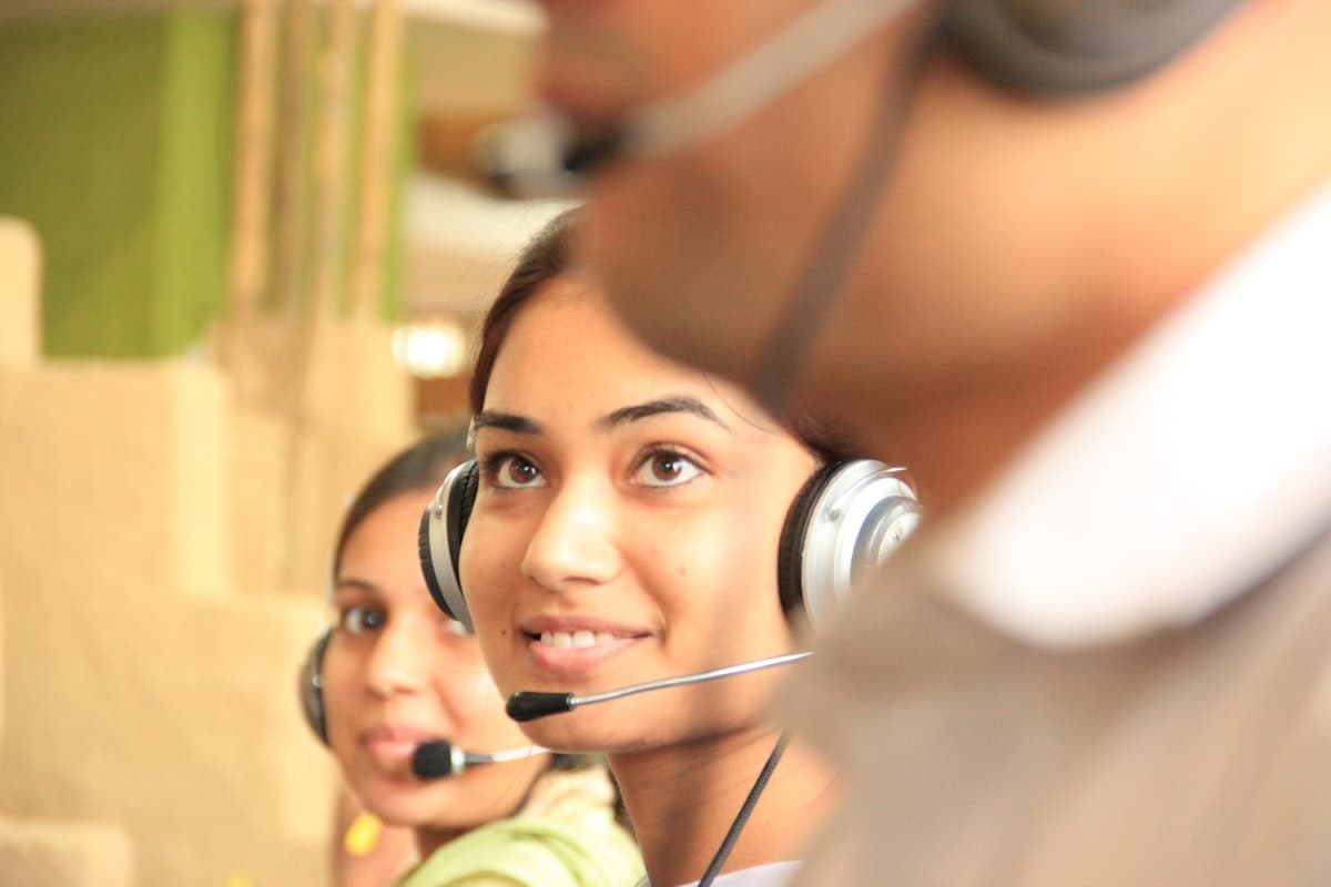 Support specialist with a headset, smiling
